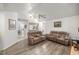 Spacious living room featuring hardwood floors and a comfortable seating arrangement for relaxation at 9530 Sw 189Th Ct, Dunnellon, FL 34432