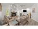 Open-concept living area with a fireplace, and high ceilings, creating an airy and inviting space at 9530 Sw 189Th Ct, Dunnellon, FL 34432
