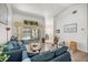 Bright living room with sliding doors to the lanai and an open connection to other rooms in the home at 9530 Sw 189Th Ct, Dunnellon, FL 34432