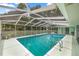 Relaxing screened-in pool area for leisure at 9530 Sw 189Th Ct, Dunnellon, FL 34432