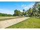 Outdoor recreational area with bocce ball courts, a covered pavilion, and lush landscaping at 9530 Sw 189Th Ct, Dunnellon, FL 34432
