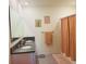 Bathroom with double sinks, granite countertop and a peach shower curtain at 3974 Mekong Ct, St Cloud, FL 34772