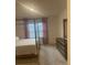 A neutral colored bedroom features a four poster bed and a wooden dresser at 3974 Mekong Ct, St Cloud, FL 34772