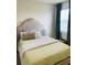 Serene bedroom with natural light from a window, decorative pillows, and soothing colors at 3974 Mekong Ct, St Cloud, FL 34772