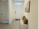 Inviting entryway with tiled floor, neutral color, and a cozy bench perfect for seating at 3974 Mekong Ct, St Cloud, FL 34772