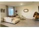 Bright living room showcasing modern decor, neutral tones, and tile flooring for a cozy, inviting space at 3974 Mekong Ct, St Cloud, FL 34772