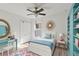 Bright bedroom with a ceiling fan, modern furniture, and a white closet door with white trim at 109 James Cir, Lake Alfred, FL 33850