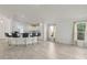 Open concept living space features tile floors, breakfast bar, and bright natural light at 109 James Cir, Lake Alfred, FL 33850