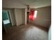 Bedroom featuring carpet, ceiling fan, and view of exterior window at 408 S Orange Ave, Fort Meade, FL 33841