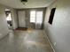 View of the living room with an exterior window and door to the outside at 408 S Orange Ave, Fort Meade, FL 33841