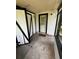 Enclosed porch with a tiled floor and framed windows that offers an inviting outdoor living space at 408 S Orange Ave, Fort Meade, FL 33841