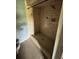 Shower with outdated tile and flooring at 408 S Orange Ave, Fort Meade, FL 33841