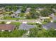 Community aerial displaying the home's location with mature trees, quiet streets, and neighborhood charm at 34 Aaron Cir, Ormond Beach, FL 32174