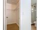 Walk-in closet with wire shelving; ensuite bathroom boasts frameless glass shower at 34 Aaron Cir, Ormond Beach, FL 32174