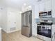 Updated kitchen featuring stainless steel appliances and white cabinets at 34 Aaron Cir, Ormond Beach, FL 32174
