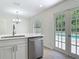 Bright kitchen featuring stainless steel appliances and a view of the pool at 34 Aaron Cir, Ormond Beach, FL 32174