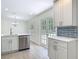 Bright kitchen featuring stainless steel appliances and an inviting pool view at 34 Aaron Cir, Ormond Beach, FL 32174