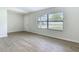 Spacious living room with wood-look floors and ample natural light at 34 Aaron Cir, Ormond Beach, FL 32174
