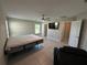 Open bedroom with tile floor, ceiling fan and natural light at 1509 Venice Ln, Davenport, FL 33896