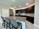 Stylish kitchen with granite counters, stainless appliances and eat-in island at 1509 Venice Ln, Davenport, FL 33896