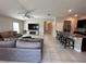 Spacious living room with ceiling fan, tile floors and open concept design at 1509 Venice Ln, Davenport, FL 33896
