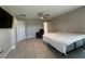 Primary bedroom offers neutral colors and a ceiling fan at 1509 Venice Ln, Davenport, FL 33896