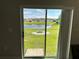 Pond view with grass yard and rock firepit at 1509 Venice Ln, Davenport, FL 33896