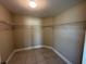 Spacious walk-in closet with tile floor and wire shelving at 1509 Venice Ln, Davenport, FL 33896