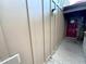 The covered entrance of this home has natural looking trim and a bright red door at 5310 Pebble Beach Dr # F, Orlando, FL 32811
