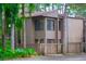The exterior of this home has natural looking trim, a front entrance, and tropical-looking shrubbery at 5310 Pebble Beach Dr # F, Orlando, FL 32811