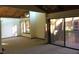Spacious living room with exposed beam vaulted ceilings and glass sliding doors to the outside patio at 5310 Pebble Beach Dr # F, Orlando, FL 32811