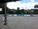Community pool area with ample seating and well-maintained surroundings at 5310 Pebble Beach Dr # F, Orlando, FL 32811
