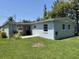 Exterior view of a home featuring a covered patio, offering a cozy outdoor space at 705 Grandview Ave, Altamonte Springs, FL 32701