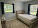 Well-lit bedroom featuring a modern rustic bed frame and contemporary curtains at 705 Grandview Ave, Altamonte Springs, FL 32701