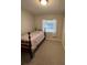 Bedroom with twin bed, neutral carpeting, and a window, suitable for a room or guest room at 705 Grandview Ave, Altamonte Springs, FL 32701