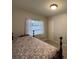 Bedroom with neutral walls, carpet floors, wood bed frame, and bright window at 705 Grandview Ave, Altamonte Springs, FL 32701