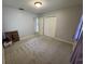 Simple bedroom with neutral carpeting, a closet, and a window, creating a blank canvas at 705 Grandview Ave, Altamonte Springs, FL 32701