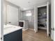 Modern bathroom featuring a glass-enclosed shower, spacious closet, and stylish vanity at 10298 Sw 96Th Loop, Ocala, FL 34481