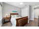 Bright bedroom featuring a wooden bed frame and neutral tones at 10298 Sw 96Th Loop, Ocala, FL 34481