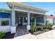 Inviting front porch with seating and desert plants at 10298 Sw 96Th Loop, Ocala, FL 34481