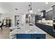 Modern kitchen featuring an island with quartz countertop and stainless steel appliances at 10298 Sw 96Th Loop, Ocala, FL 34481