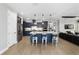 Open kitchen featuring an island with seating, stainless steel appliances, and access to the living room at 10298 Sw 96Th Loop, Ocala, FL 34481