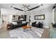 Open-concept living room with modern gray walls, recessed lighting, and a decorative ceiling fan at 10298 Sw 96Th Loop, Ocala, FL 34481