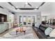 Stylish living room offering access to the outdoor patio and views of the backyard at 10298 Sw 96Th Loop, Ocala, FL 34481