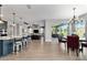 Open concept with kitchen island, dining area, and living room at 10298 Sw 96Th Loop, Ocala, FL 34481