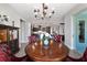 Open concept with kitchen island, dining area, and living room at 10298 Sw 96Th Loop, Ocala, FL 34481