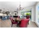 Living space showcasing the open floor plan between the kitchen, dining area, and living room at 10298 Sw 96Th Loop, Ocala, FL 34481