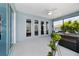 Screened patio with a hot tub and access to the yard at 10298 Sw 96Th Loop, Ocala, FL 34481