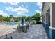 Resort-style pool area with shaded seating, lounge chairs, and well-maintained landscaping at 10298 Sw 96Th Loop, Ocala, FL 34481