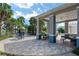 Outdoor seating area with tables and chairs around the pool, perfect for relaxation and socializing at 10298 Sw 96Th Loop, Ocala, FL 34481
